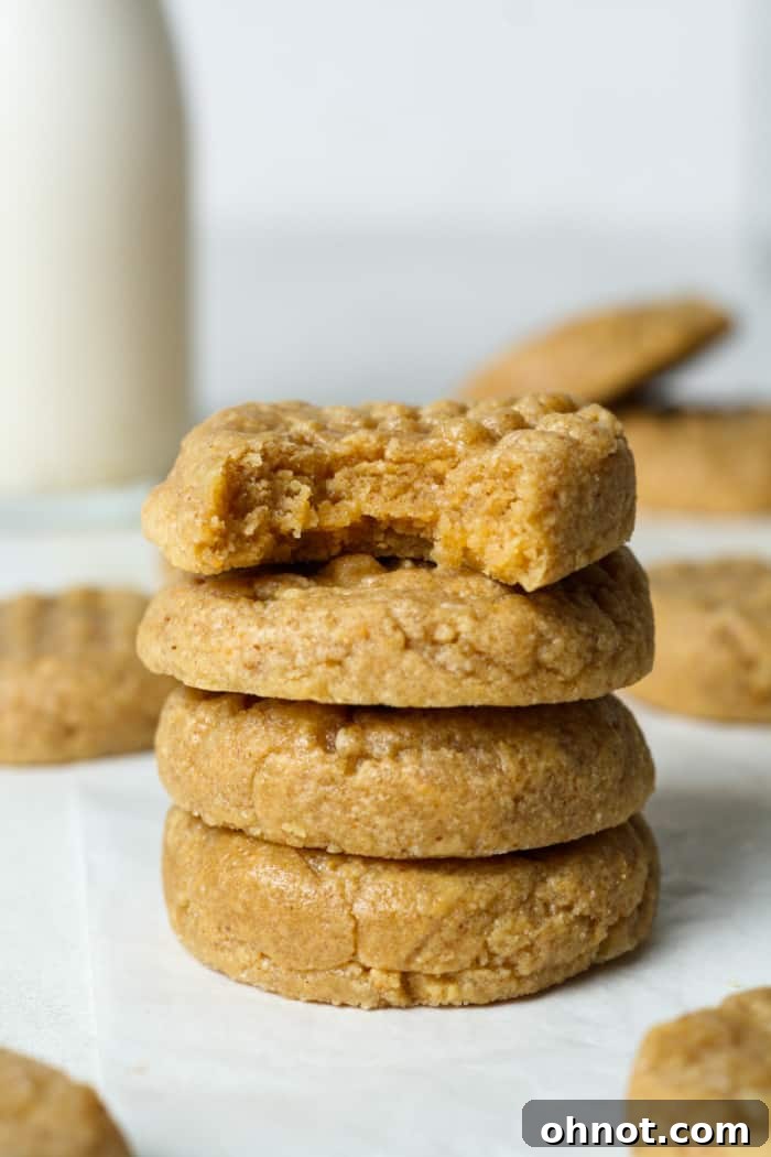 Close-up of a stack of gooey, delicious peanut butter cookies.