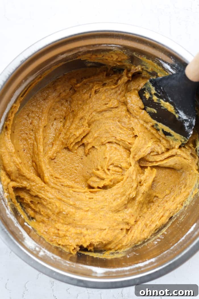 Pumpkin bread batter in a bowl after all ingredients are mixed.