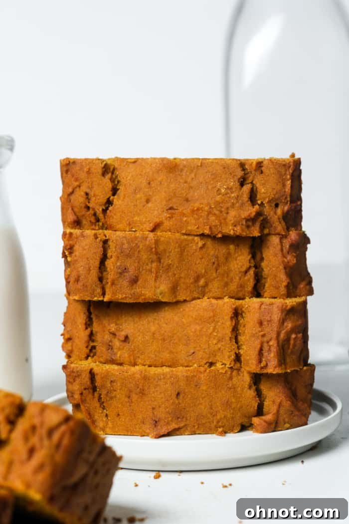 A whole gluten-free pumpkin loaf, showcasing its beautiful golden crust.