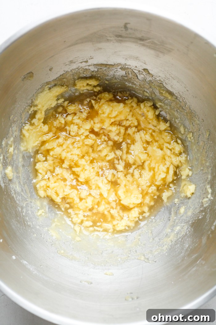 Applesauce and vanilla extract added to the creamed vegan butter and sugar mixture.