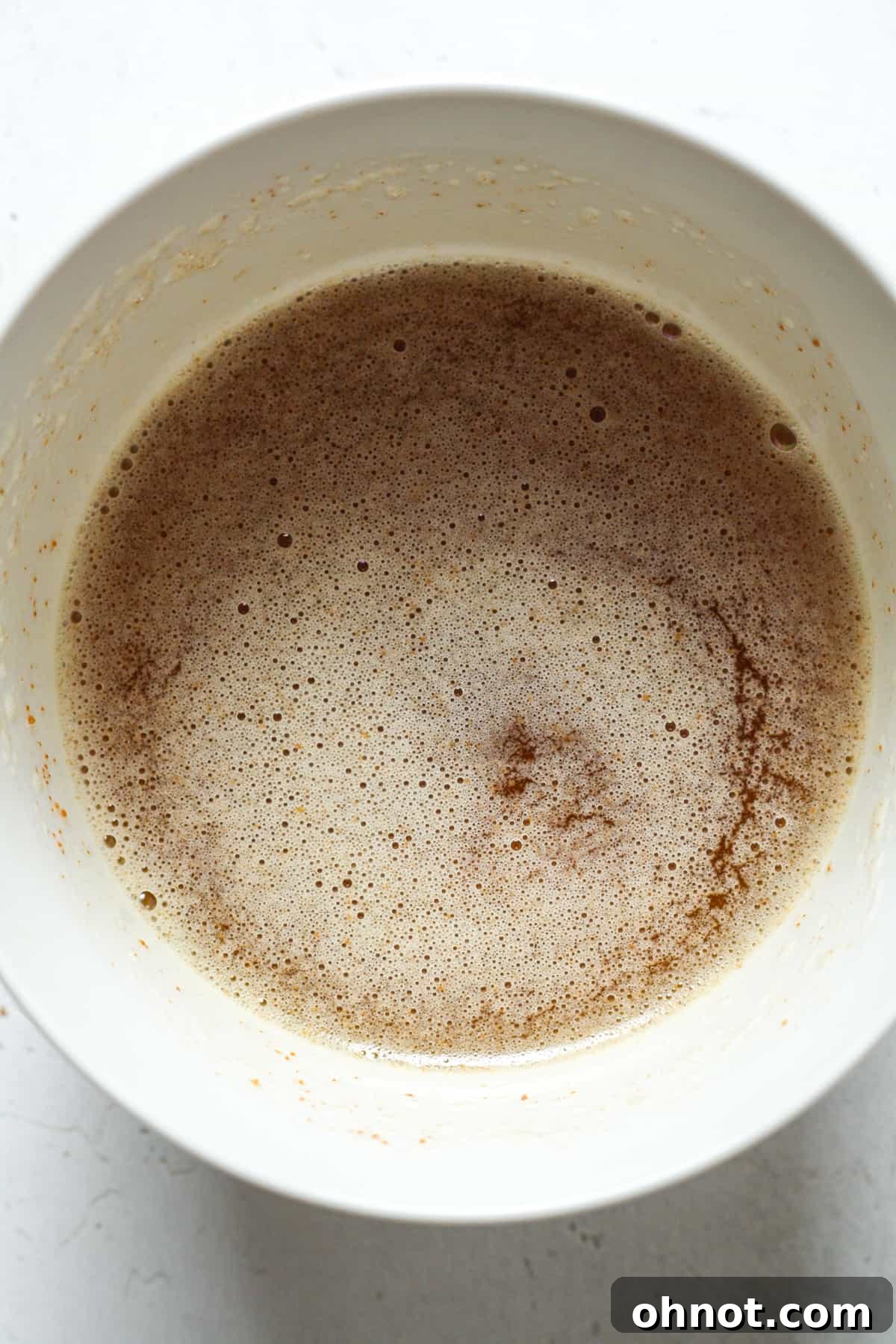 Perfectly browned butter in a measuring cup, cooled and ready for the blondie batter.