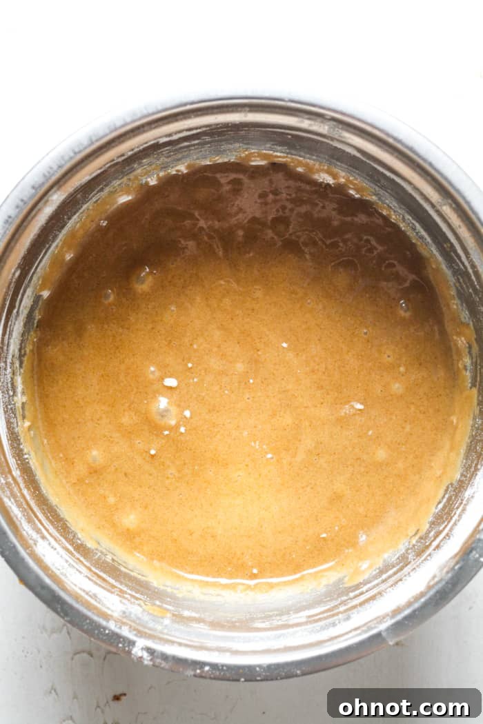 Smooth blondie batter in a mixing bowl before adding chocolate chips.