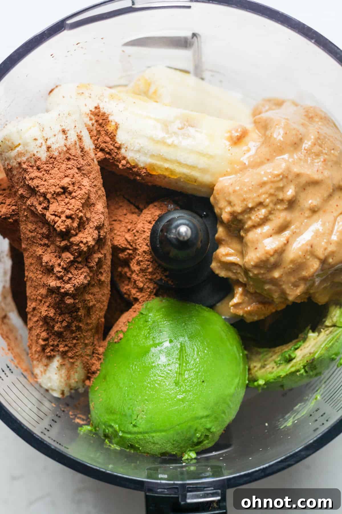 All ingredients except chocolate chips in a food processor, ready to blend.