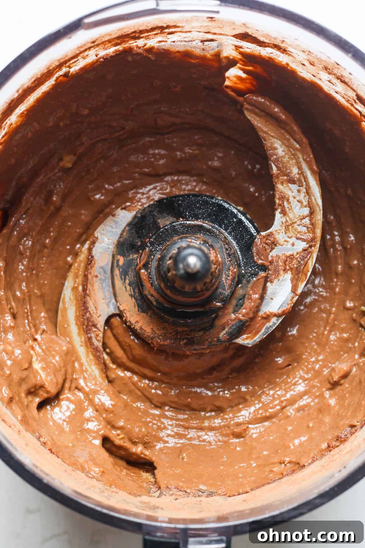 Smooth, creamy chocolate brownie batter in the food processor.