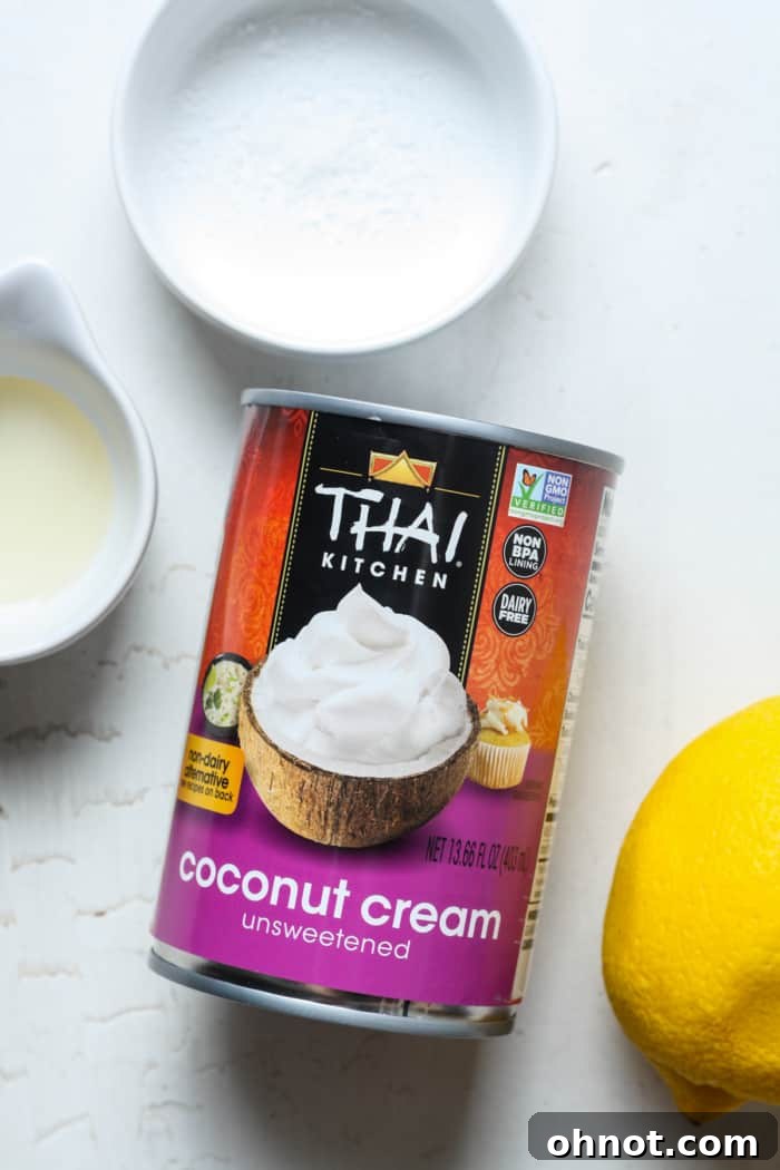 Close-up of coconut cream being prepared with lemon slices.