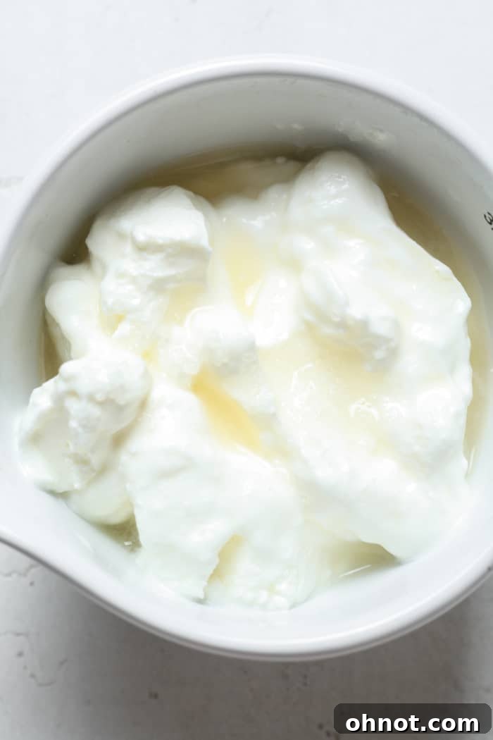 All ingredients for dairy-free sour cream added to a bowl, pre-mixing.