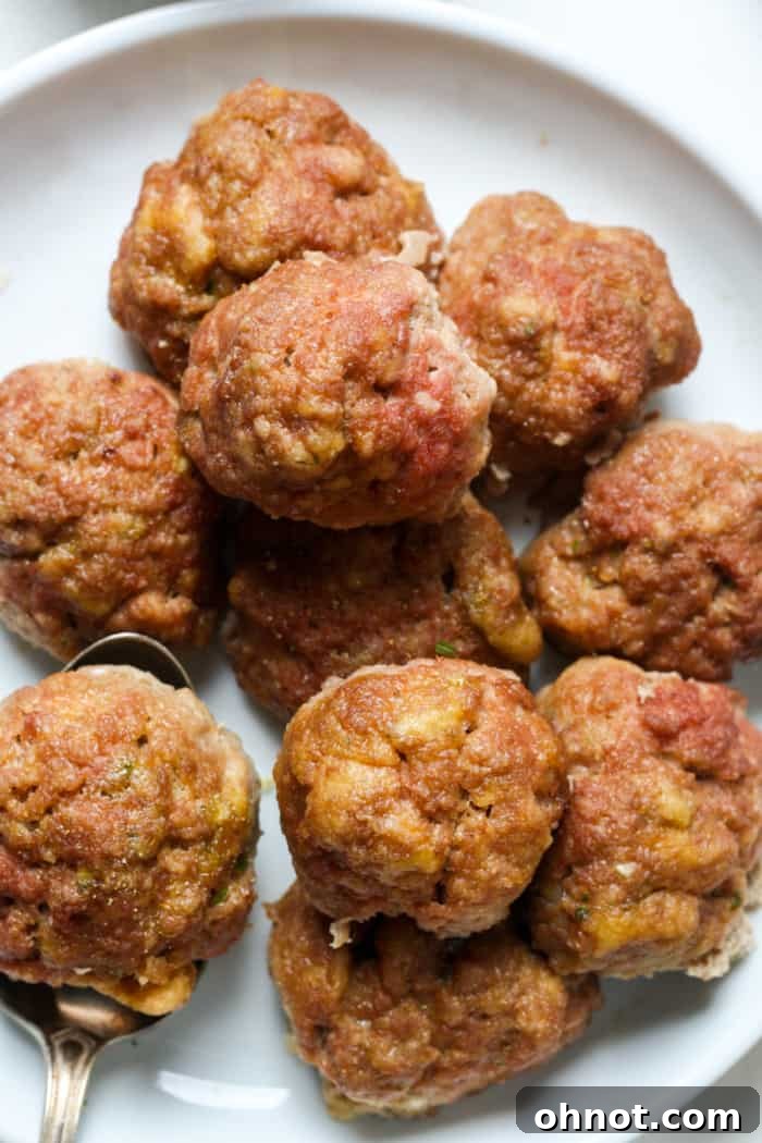 Cooked turkey meatballs on a white plate, ready for a healthy meal.