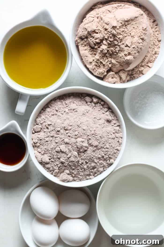 Close-up of a chocolate cake mix box and a brownie mix box, illustrating the key ingredients for the recipe.