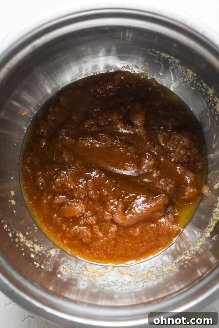 Melted vegan butter and brown sugar in a mixing bowl.