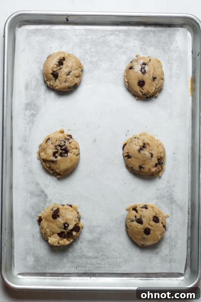 Flattened balls of cookie dough ready for baking.