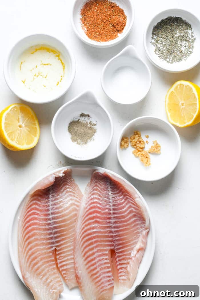Tilapia fillets and all the fresh ingredients laid out before cooking.