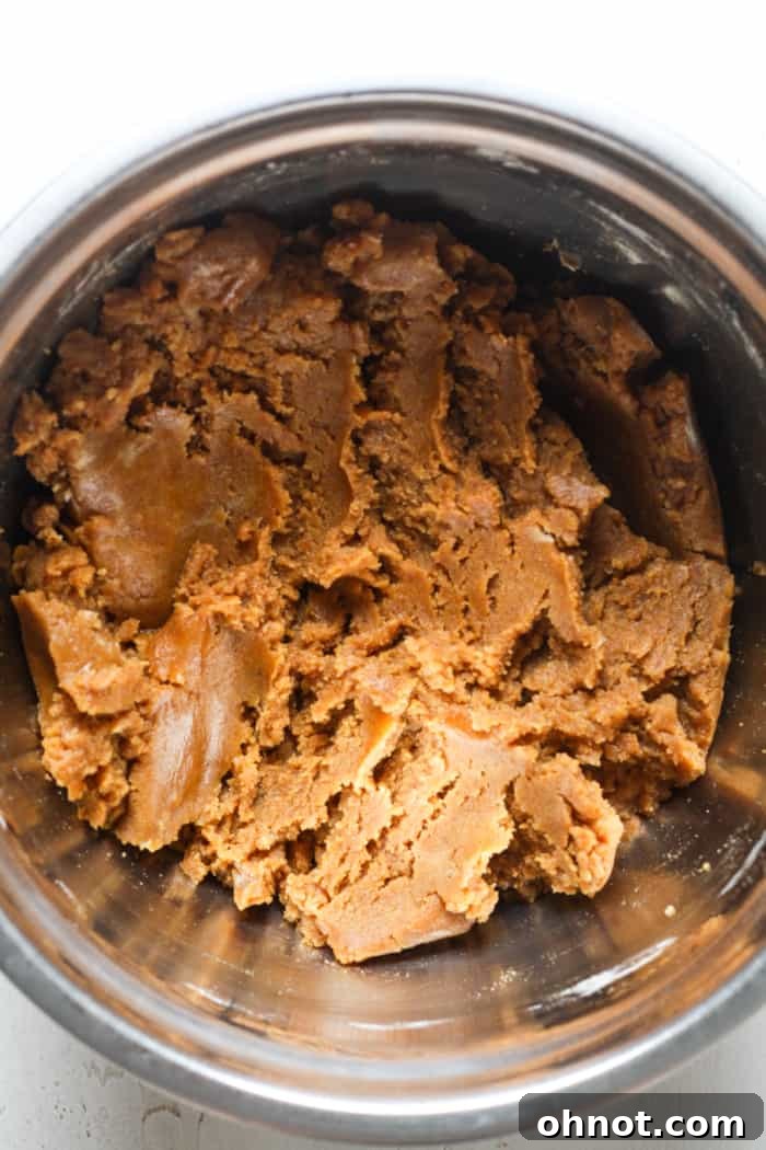 Healthy cookie dough in a mixing bowl before chocolate chips are added.