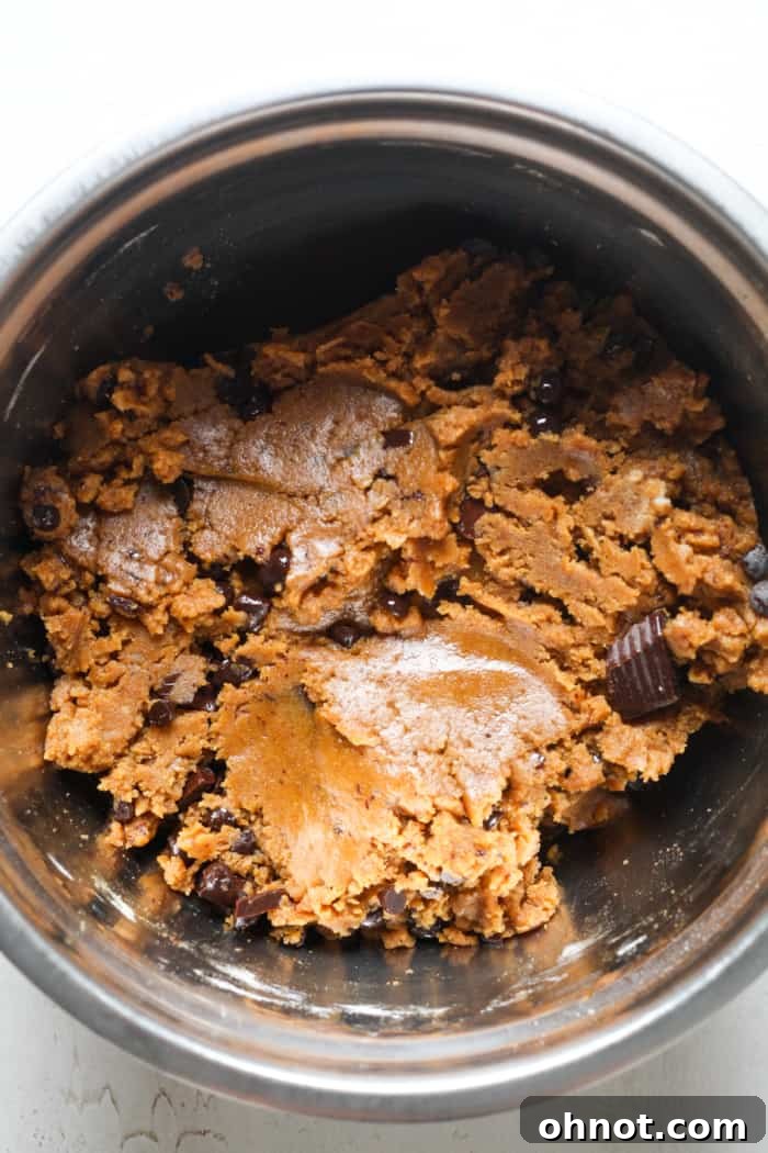 Healthy pumpkin cookie dough with chocolate chips in a bowl.