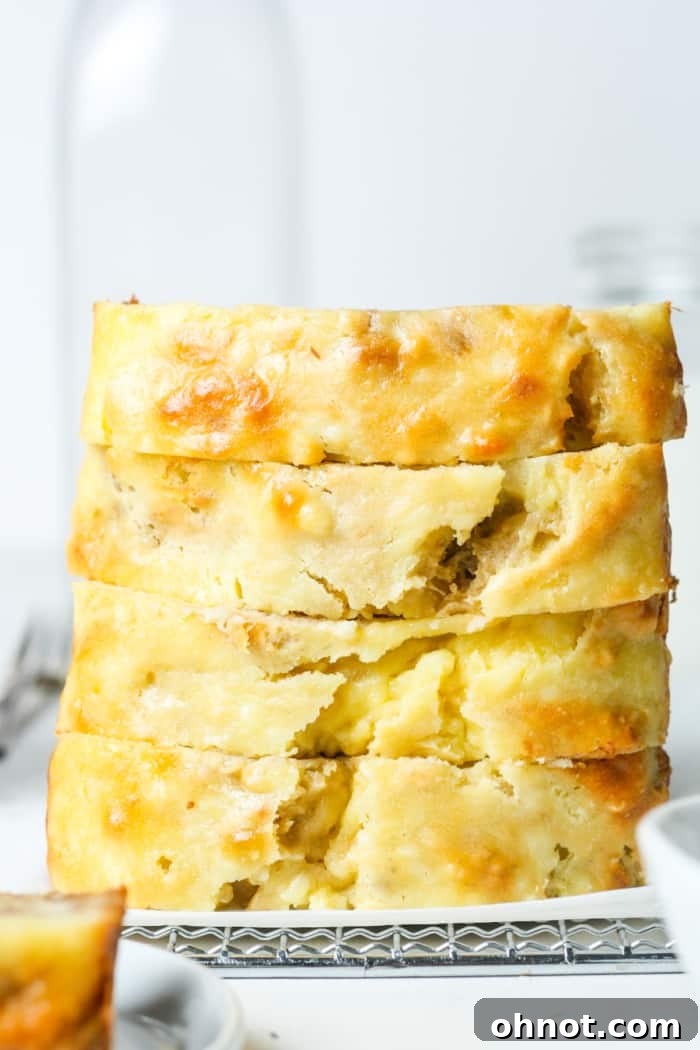 Stack of perfectly sliced cream cheese banana bread.