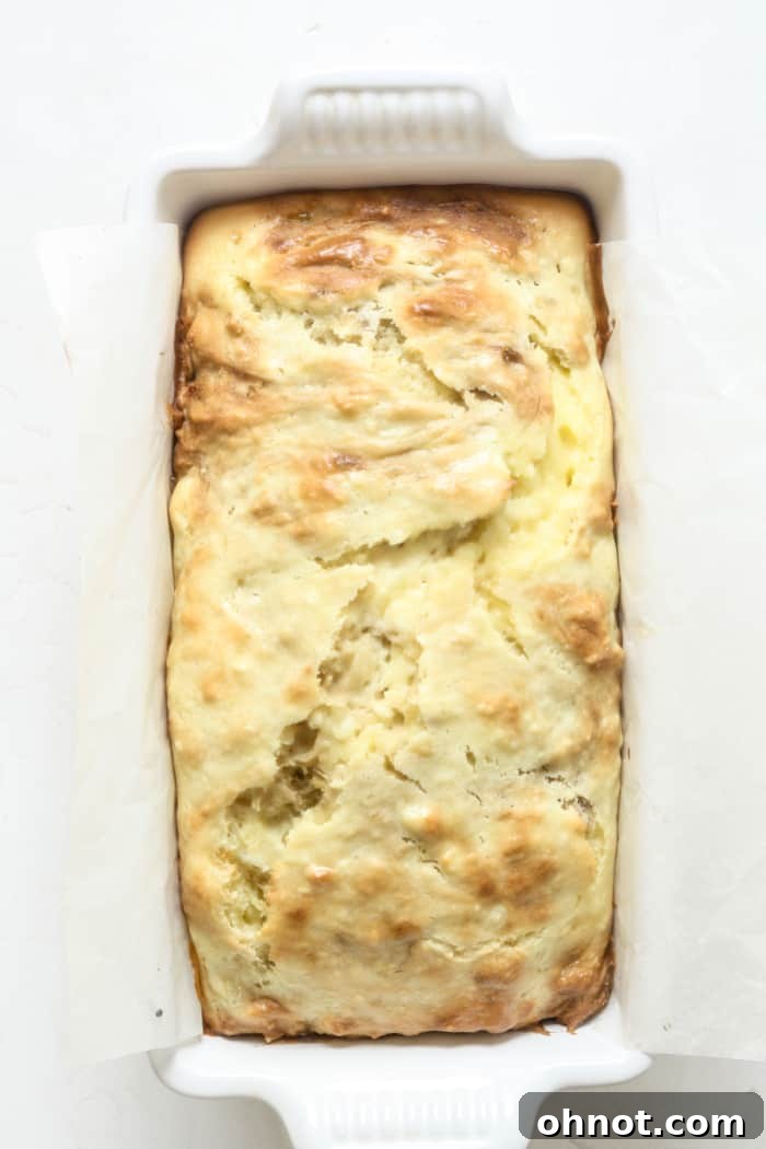 Freshly baked cream cheese banana bread in a loaf pan.
