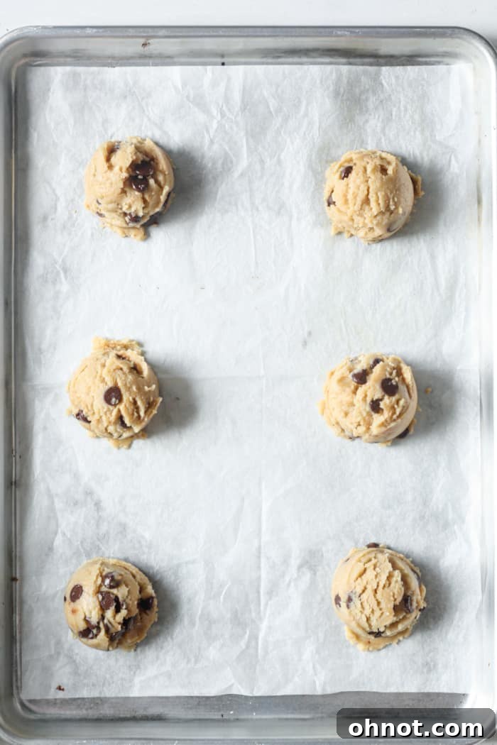 Raw peanut butter cookies on pan.