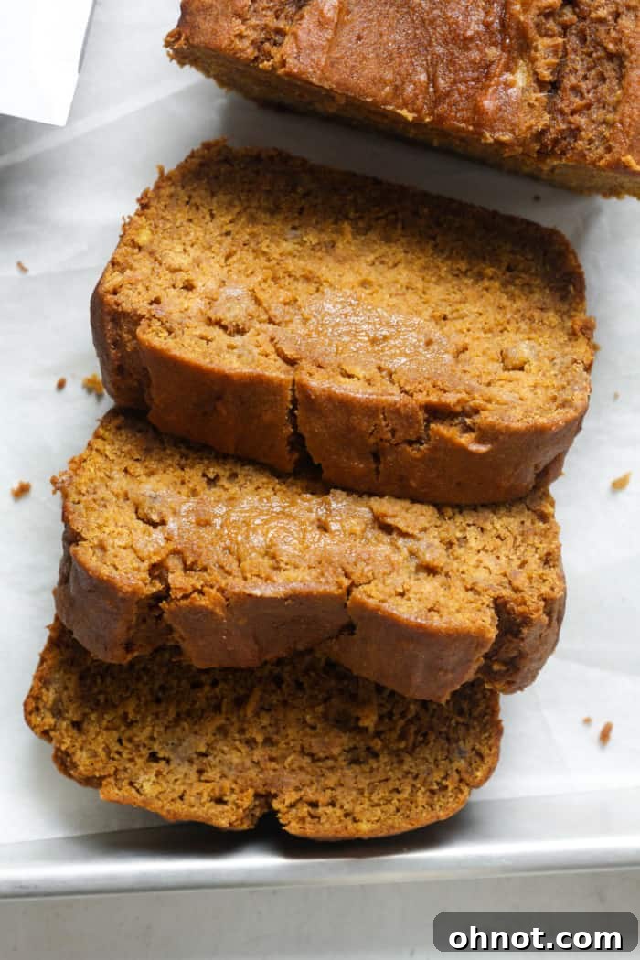 Beautifully sliced pumpkin banana bread, showcasing its moist texture and perfect crumb.