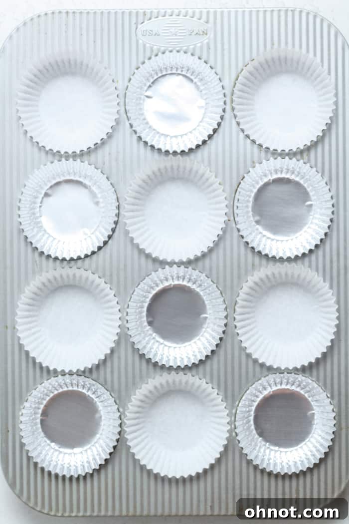 Muffin pan lined with paper cups.