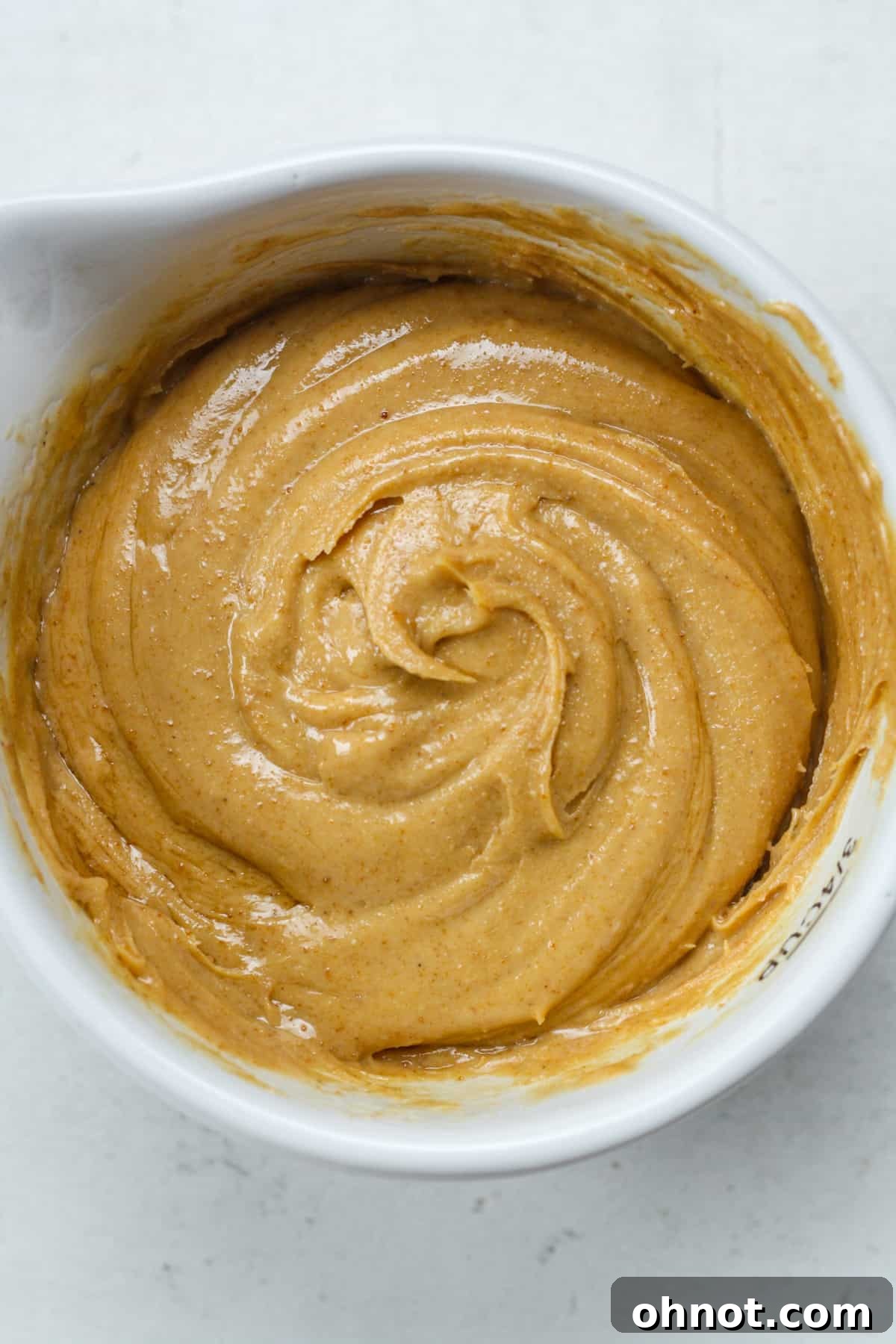 Creamy peanut butter mixture in a bowl, ready for filling.