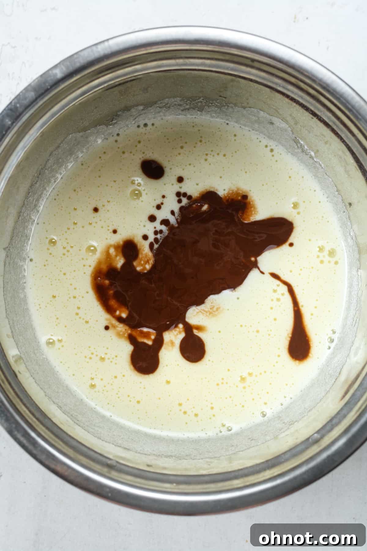 Sugar mixture with chocolate being poured in.