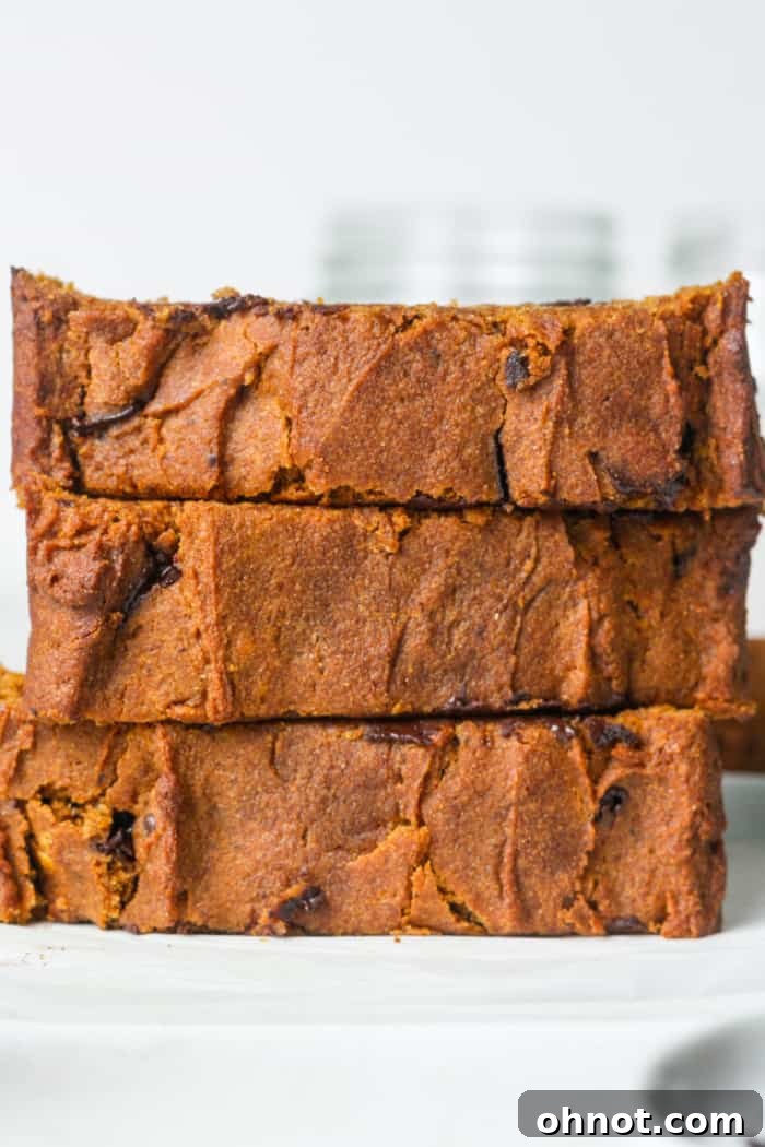 Stack of vegan pumpkin bread slices.