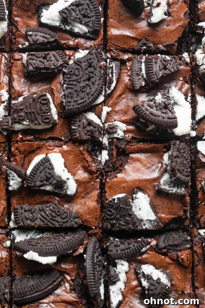 Freshly baked Oreo brownies with a beautiful crinkly top and visible crushed Oreos.