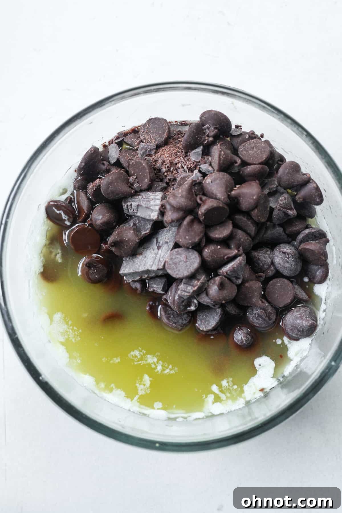 Melted butter and chocolate mixture in a bowl, ready to be combined.