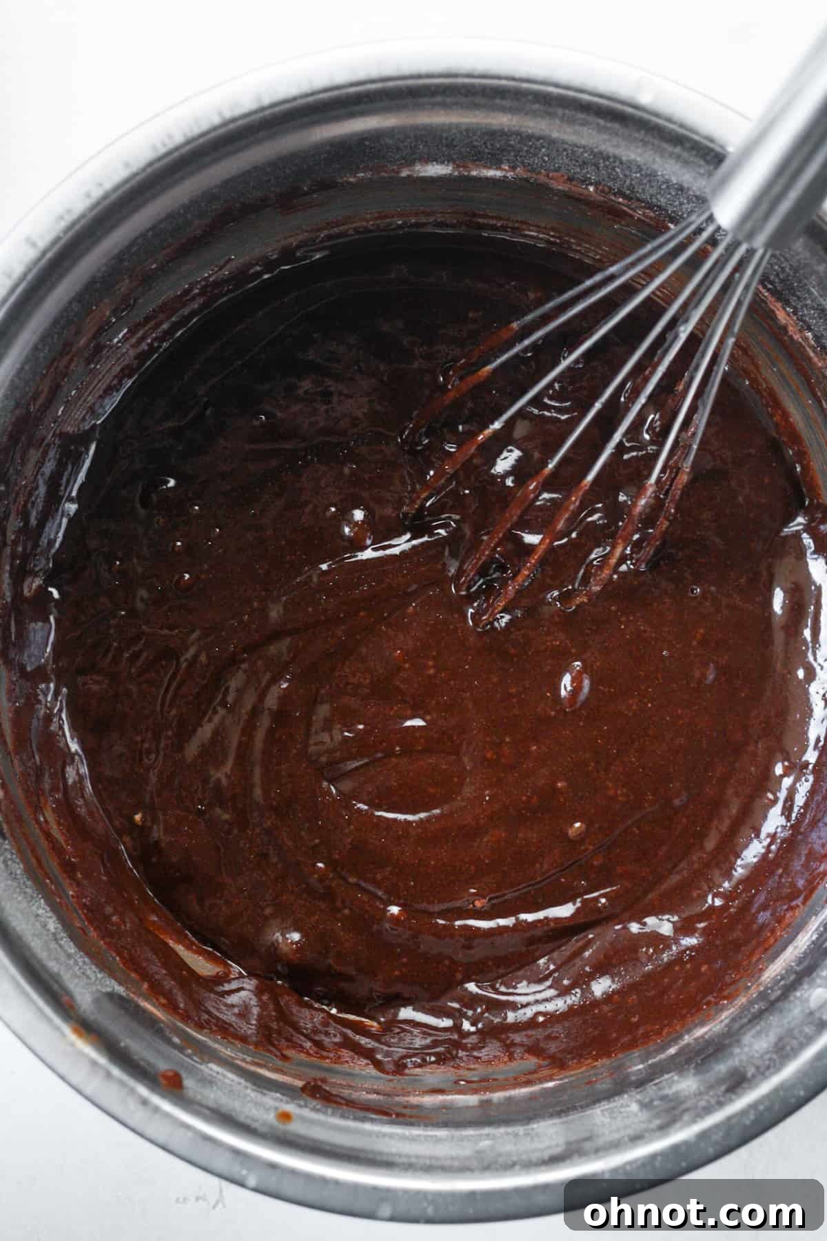 Fully combined, smooth brownie batter in a bowl, ready for the pan.