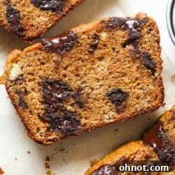 Protein banana bread with chocolate chips, sliced and ready to eat.