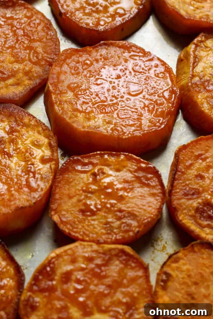 Soft sweet potatoes on a baking pan, close up.