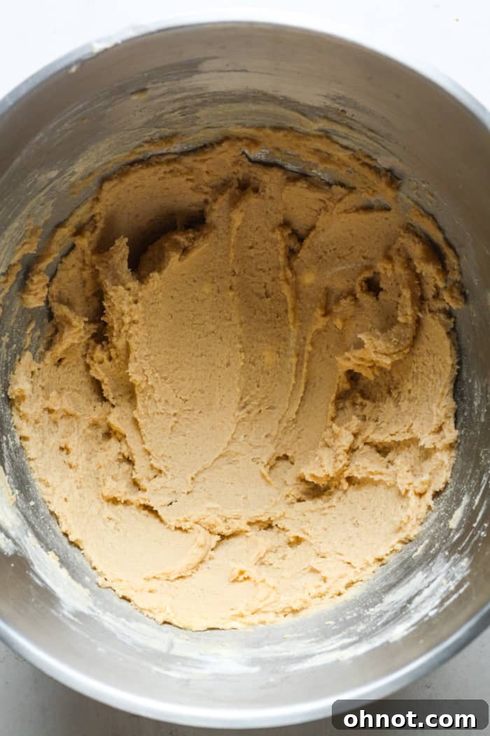 Creamed butter, brown sugar, and white sugar in a stand mixer bowl.