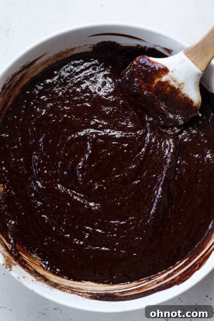Thick raw brownie batter.