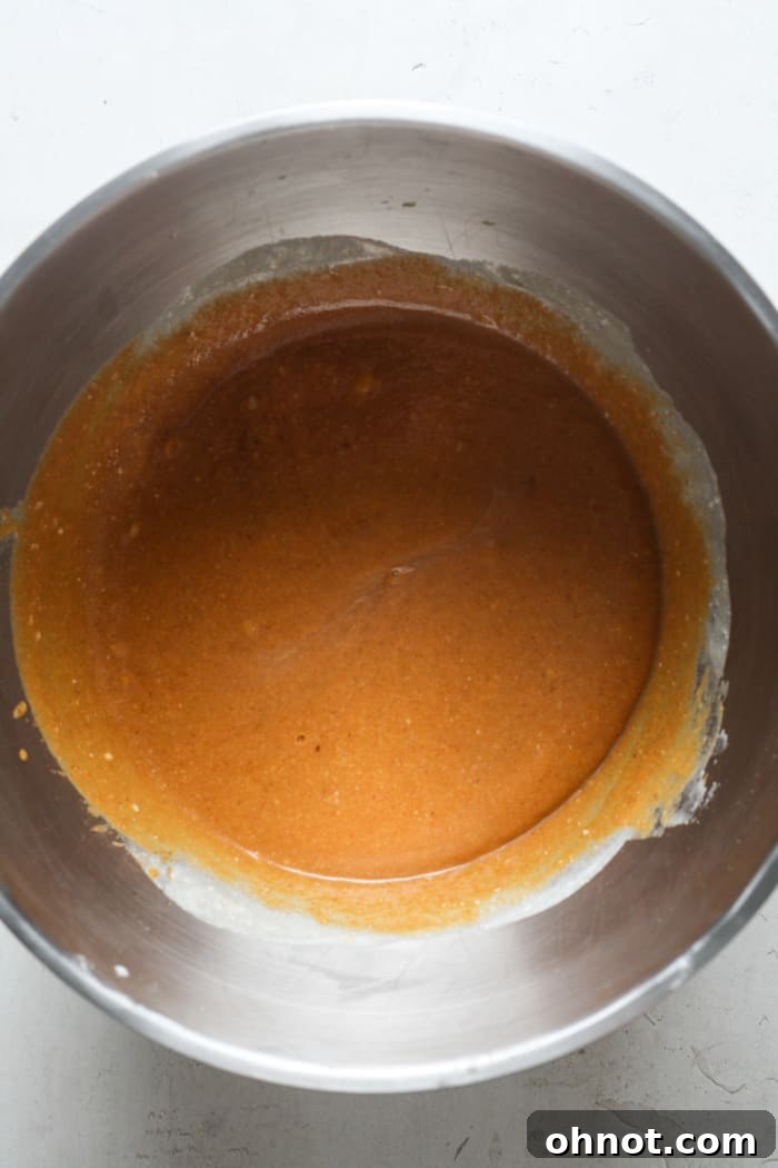 Pumpkin pie filling after all ingredients, including spices and sugar, have been mixed to a uniform consistency.
