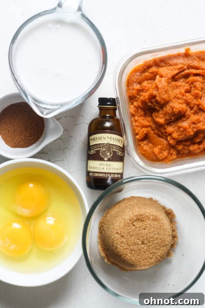 Ingredients for pumpkin pie filling: canned pumpkin, fresh eggs, and brown sugar arranged artfully on a wooden surface.