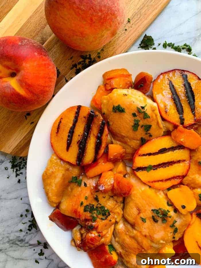 Grilled chicken with fresh, juicy peaches, a flavorful and easy summer dish.