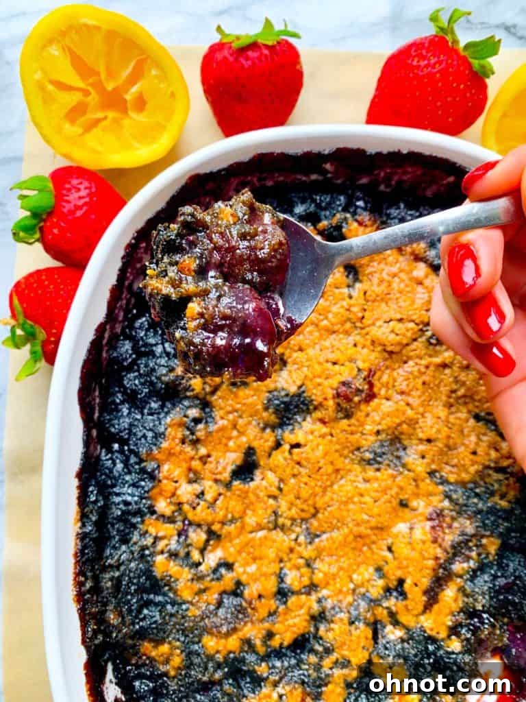 Delicious blueberry cherry crisp with a golden crumble topping, a perfect sweet and tart summer dessert.
