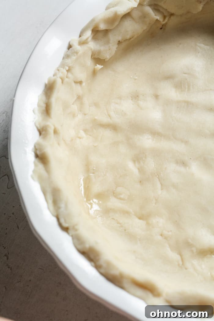 A perfectly golden-brown gluten-free pie crust, ready for filling.