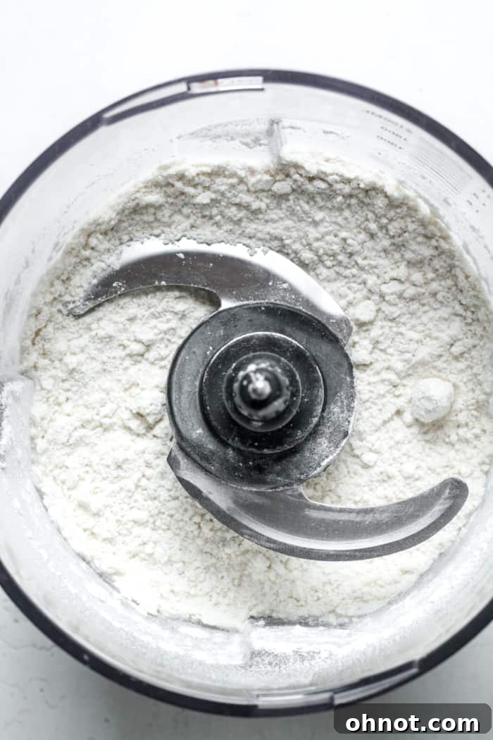 Gluten-free flour and other dry ingredients in a food processor.