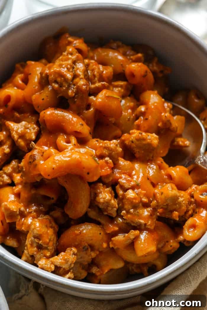 A delectable bowl of Healthy Hamburger Helper, featuring perfectly cooked noodles and a rich meat sauce, ready to be served as a wholesome family meal.