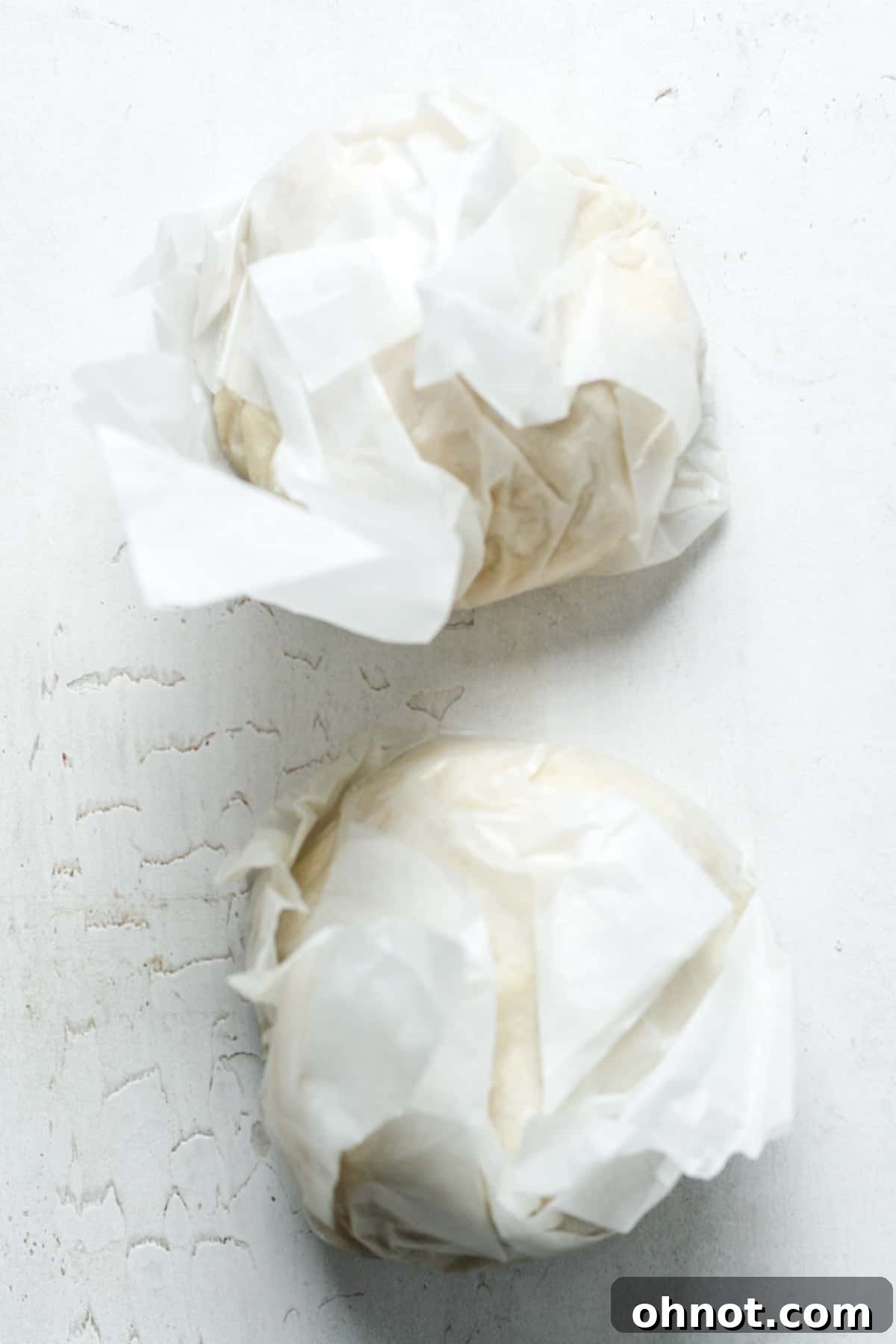 Pie dough wrapped in plastic wrap and ready for chilling.