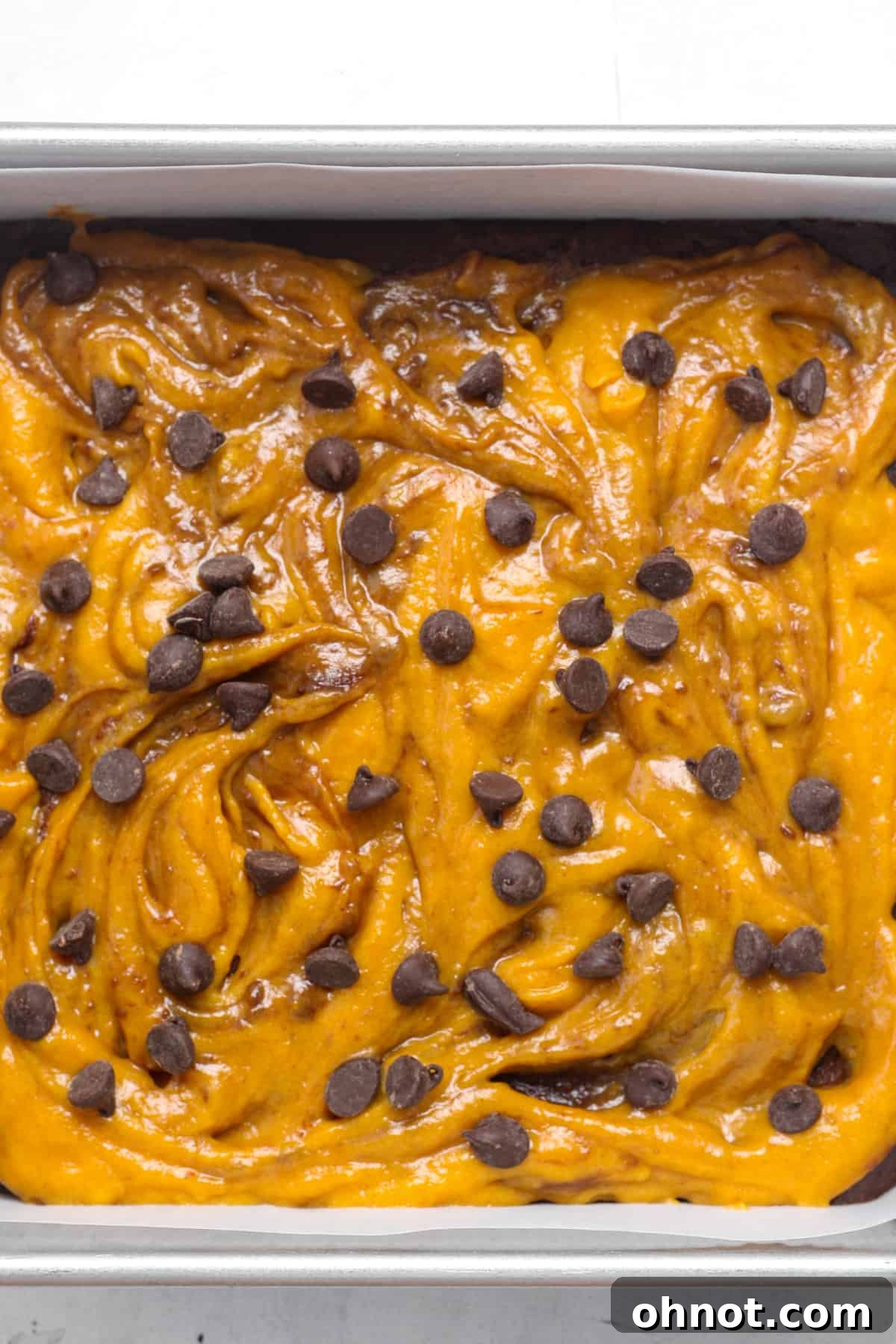 Close-up of the artfully swirled brownie batter before baking.