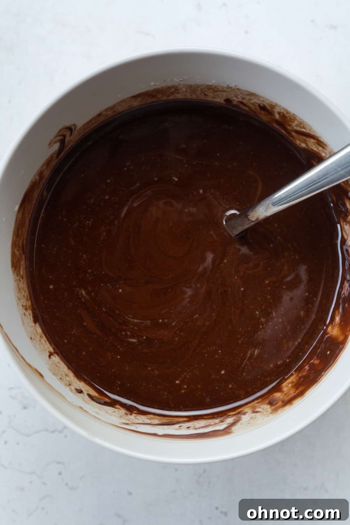 Smooth, creamy melted chocolate mixture in a bowl.
