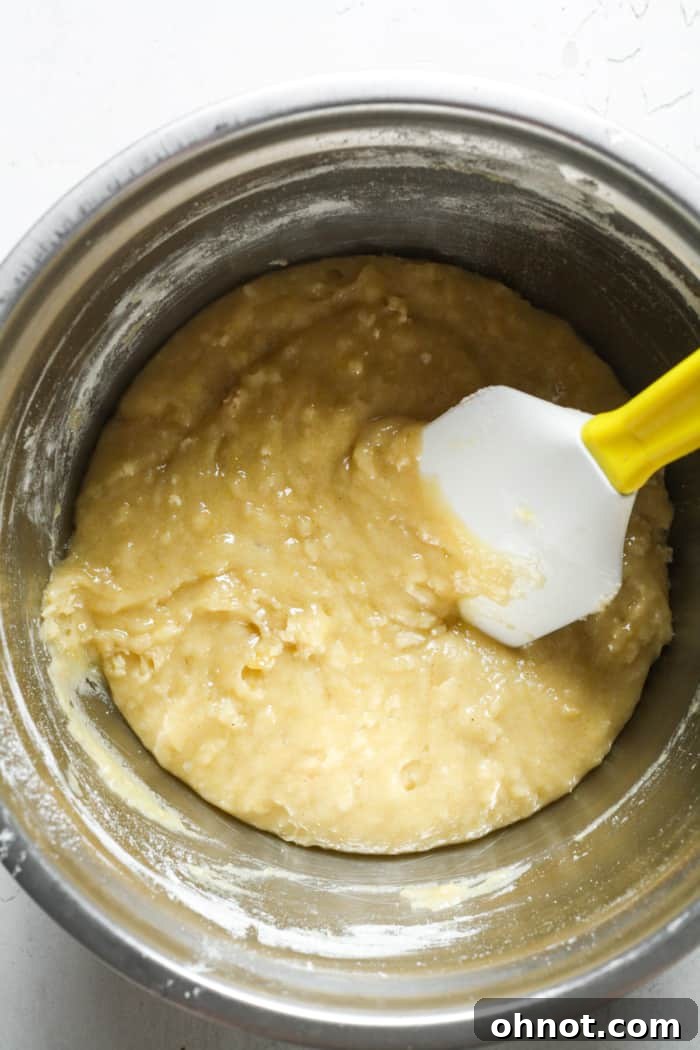 Thick quick bread batter in a mixing bowl.