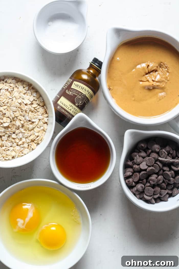 Close-up of oatmeal, eggs, and other wholesome ingredients laid out for baking.