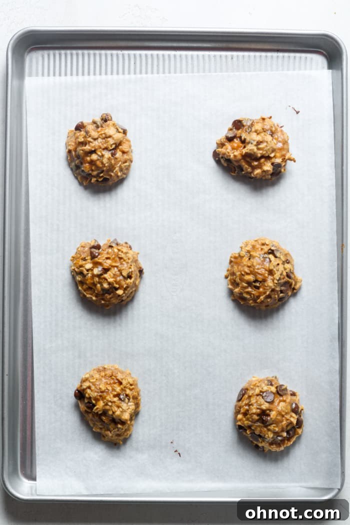 Baked flourless cookies cooling on a pan.