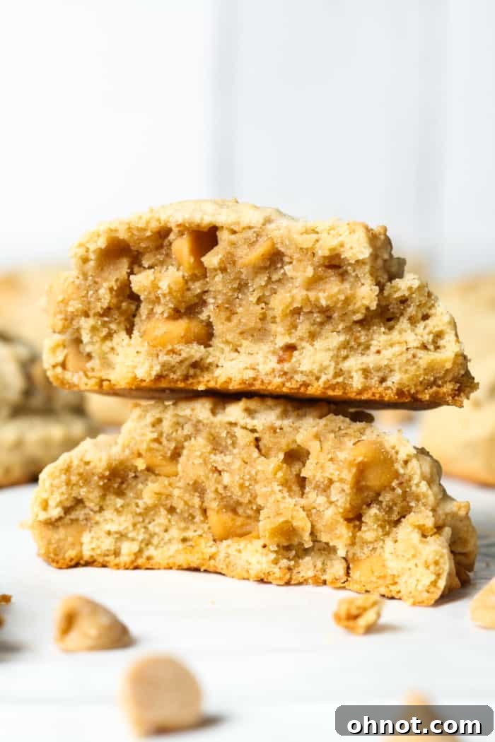 Close-up of a gooey peanut butter cookie, showing its soft center and melted chips.