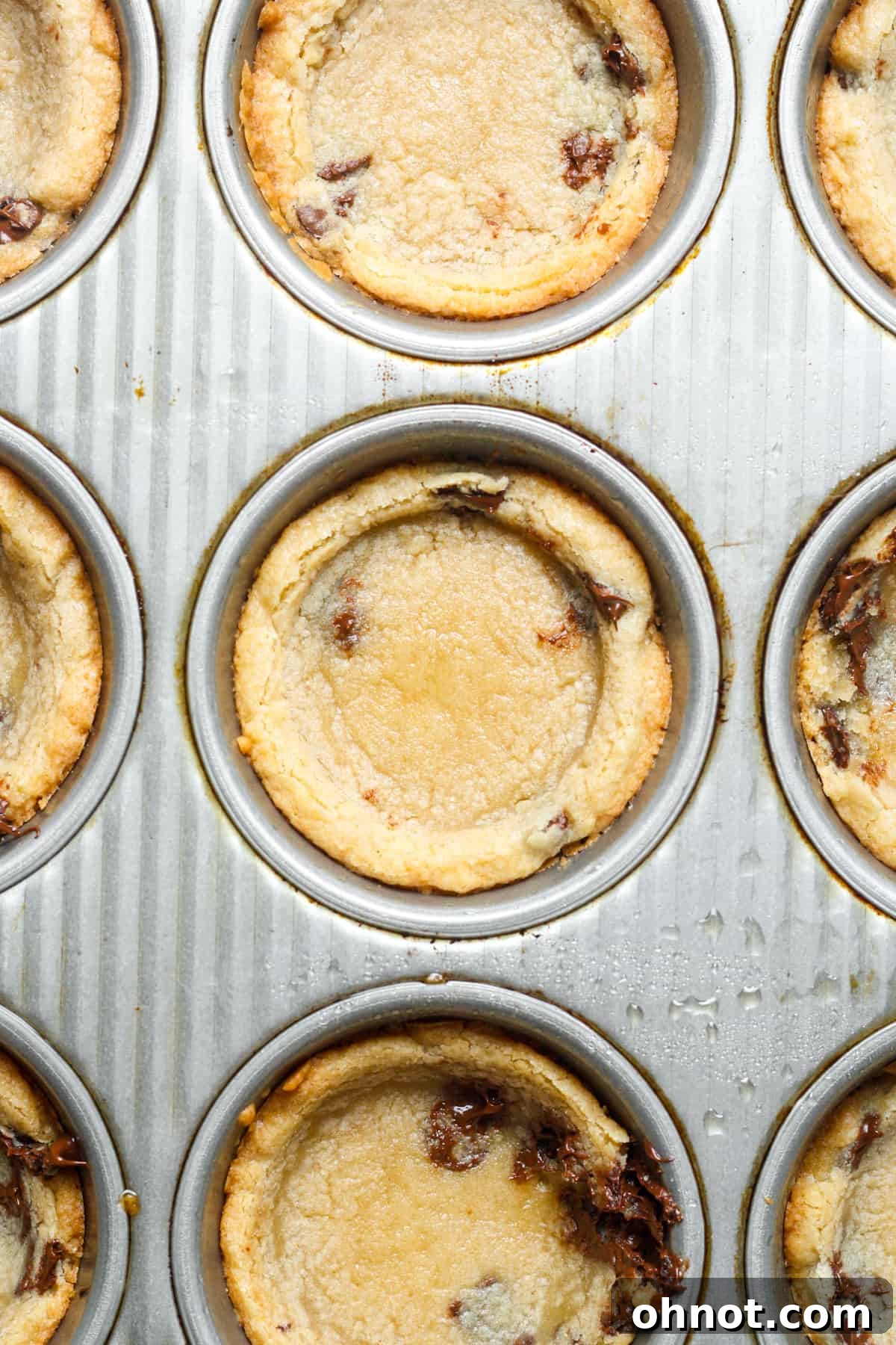 Close-up of freshly baked cookie cups with perfect indentations.