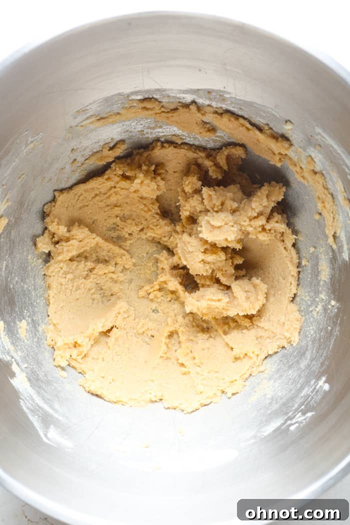 Light brown, creamy dough after butter and sugars are mixed.