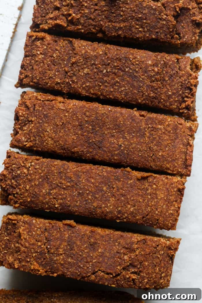Deliciously moist two-ingredient pumpkin bread, sliced and ready to eat.