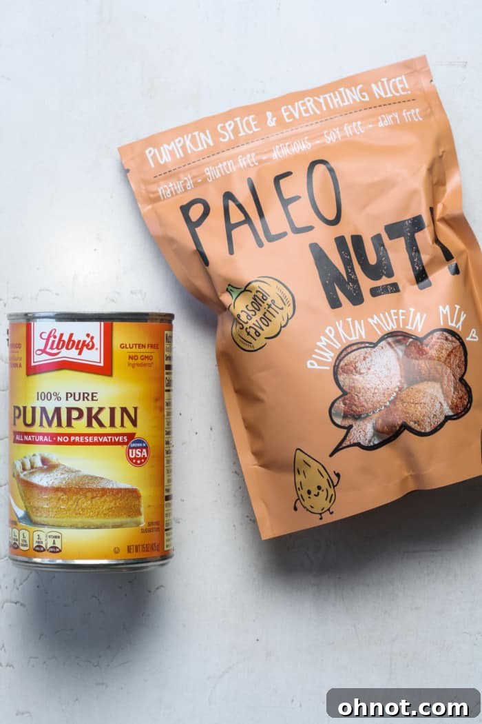 Canned pumpkin purée next to a box of muffin mix, illustrating the two simple ingredients.
